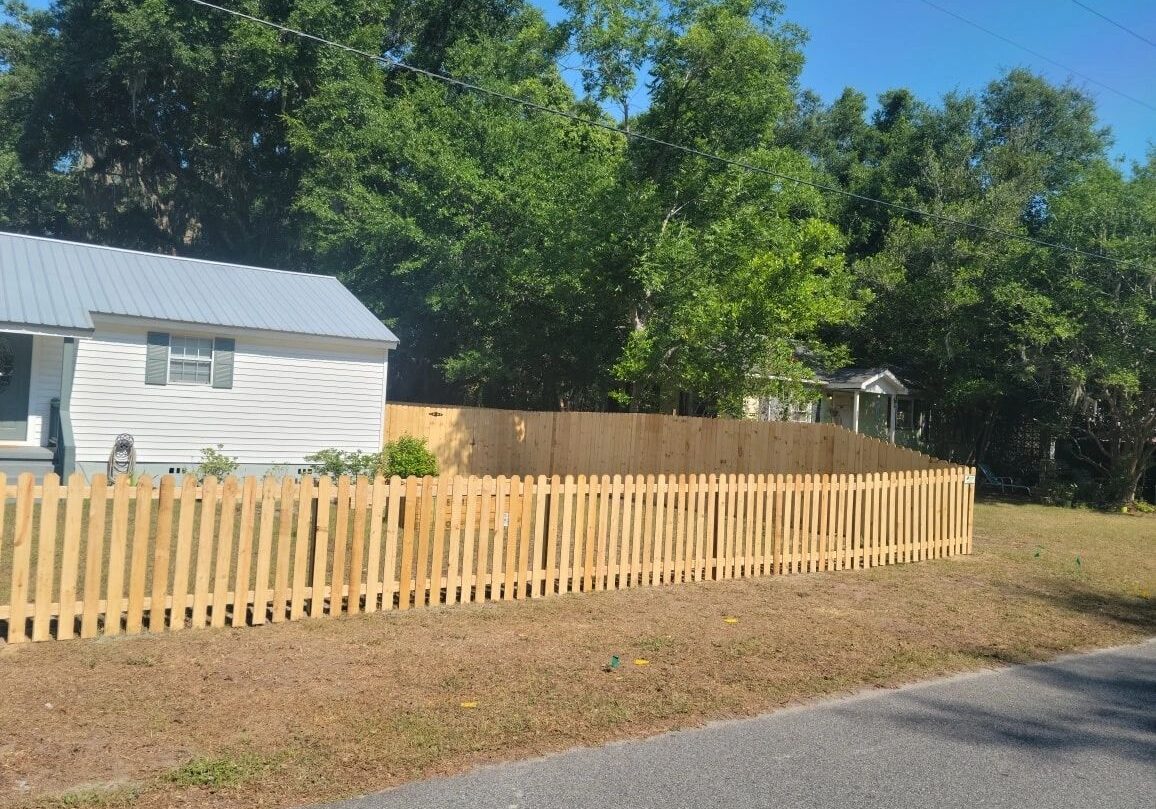 A house with a fence in the background