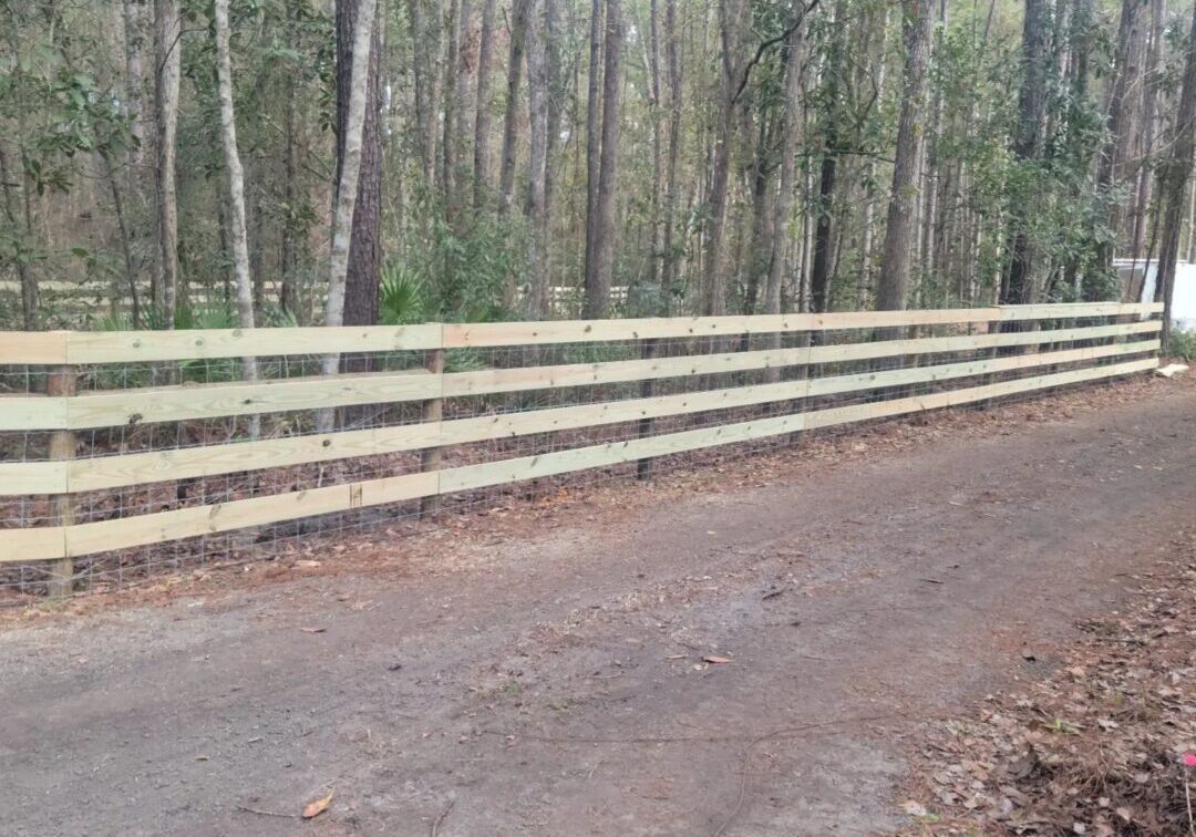 A road with some trees and a fence